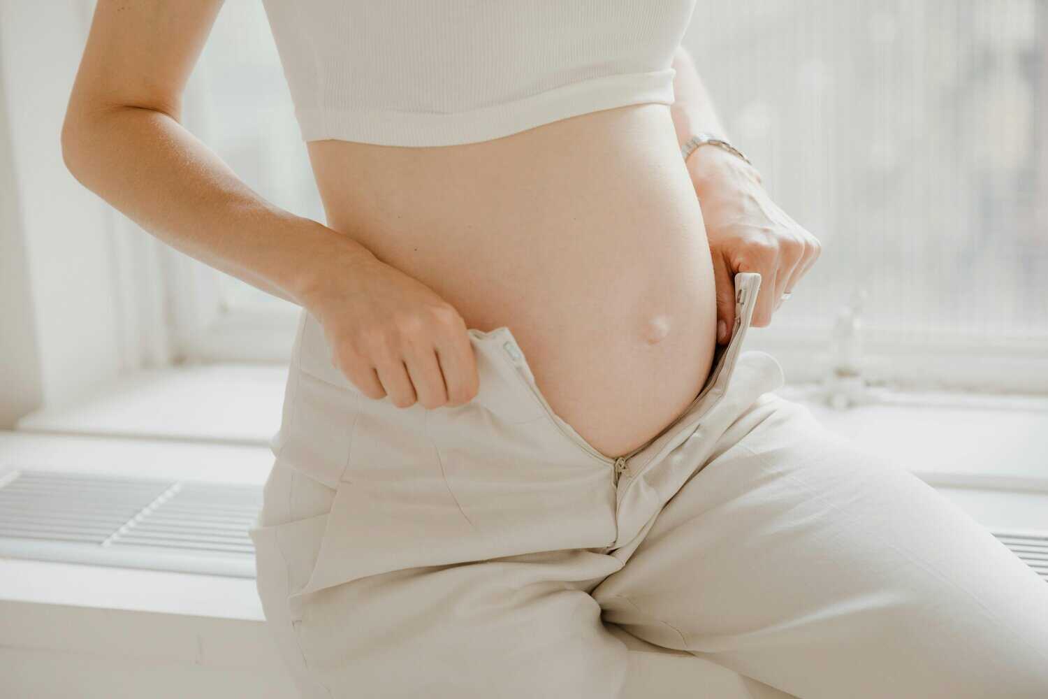 A pregnant woman in the second trimester, one of the stages during pregnancy.